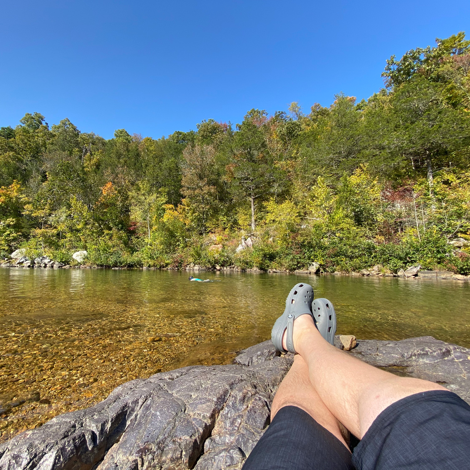 Cullen Whitmore lounging by a stream