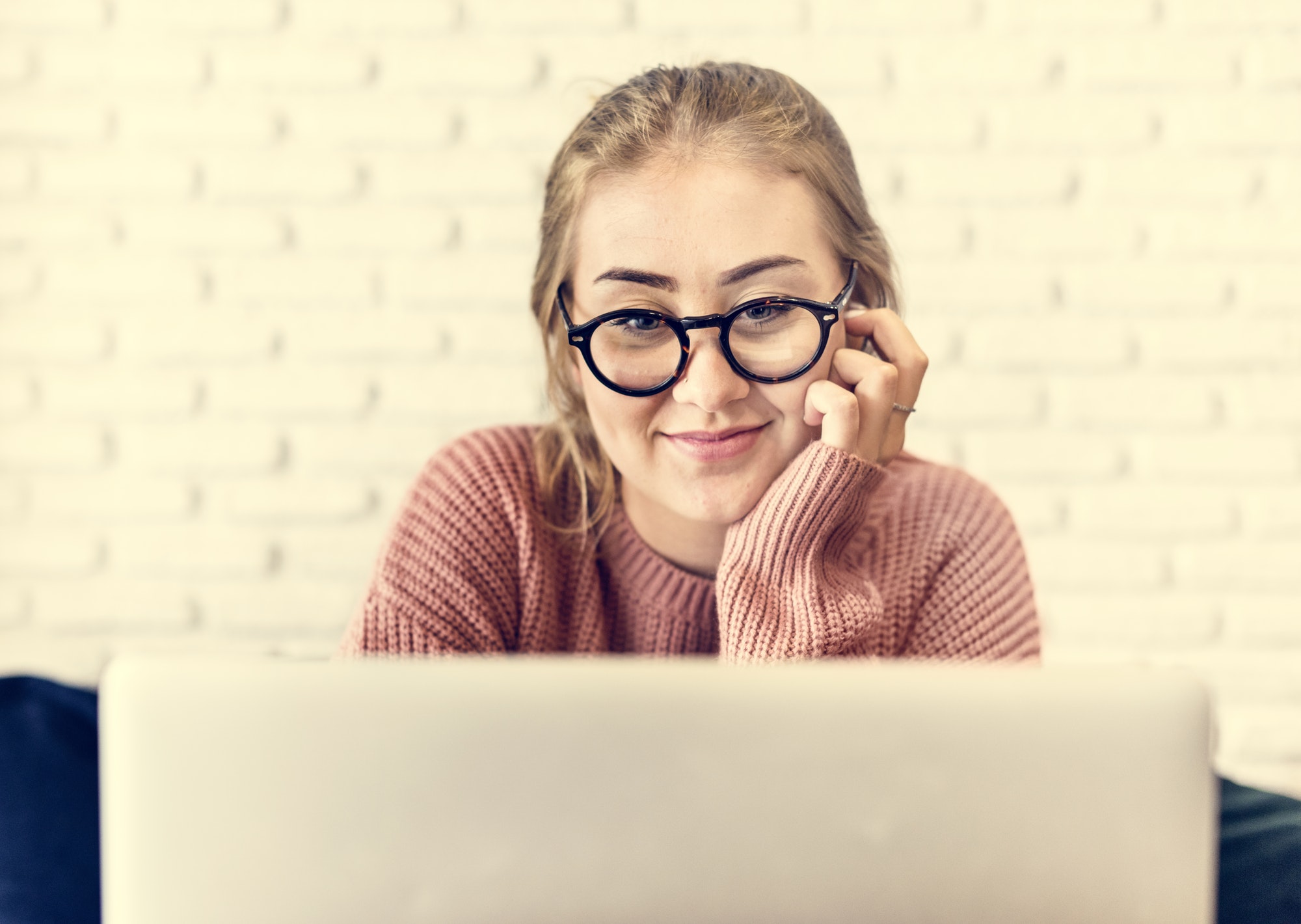 Woman using the internet and seeing ads from several sources