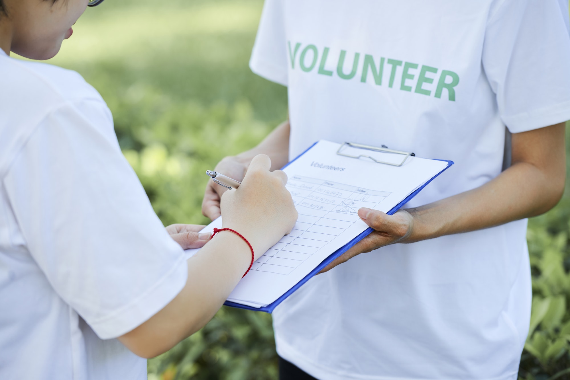 St. Louis Nonprofit SEO And Marketing Services. Volunteer Signing People Up.