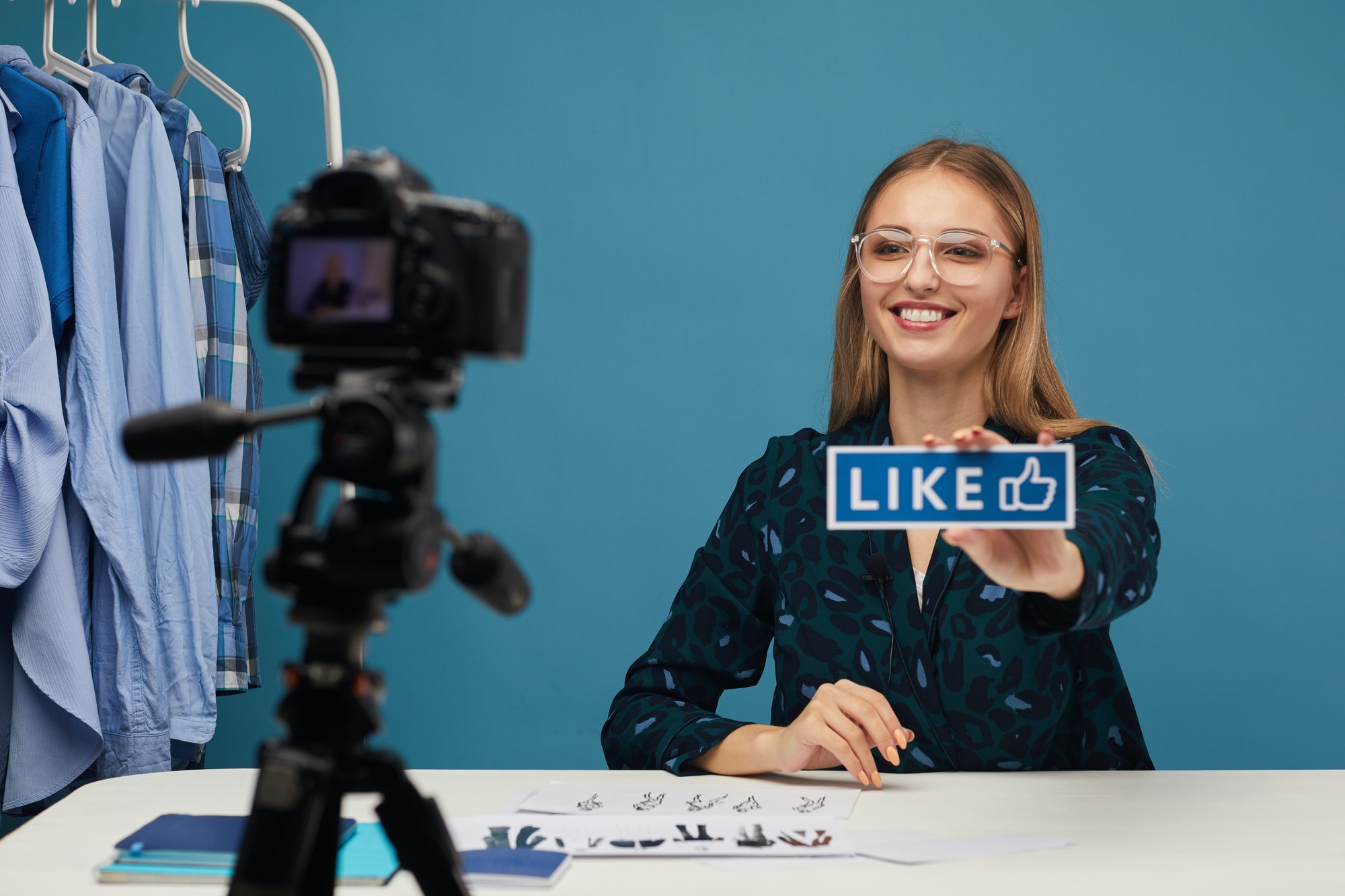 Using empathy to create accessible content. Girl showing a like sign to a camera.