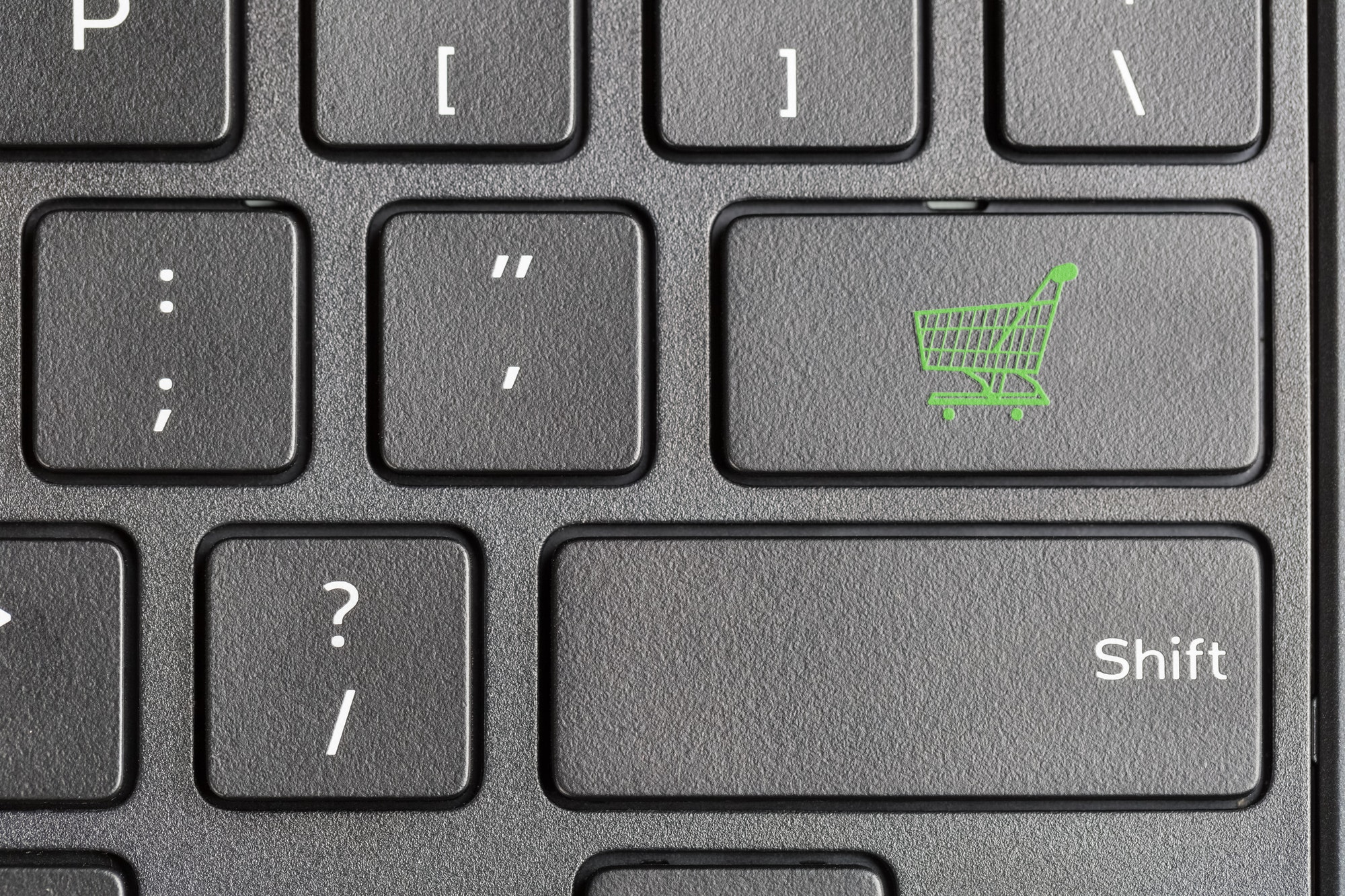 Shopping cart icon on computer keyboard for eCommerce store.