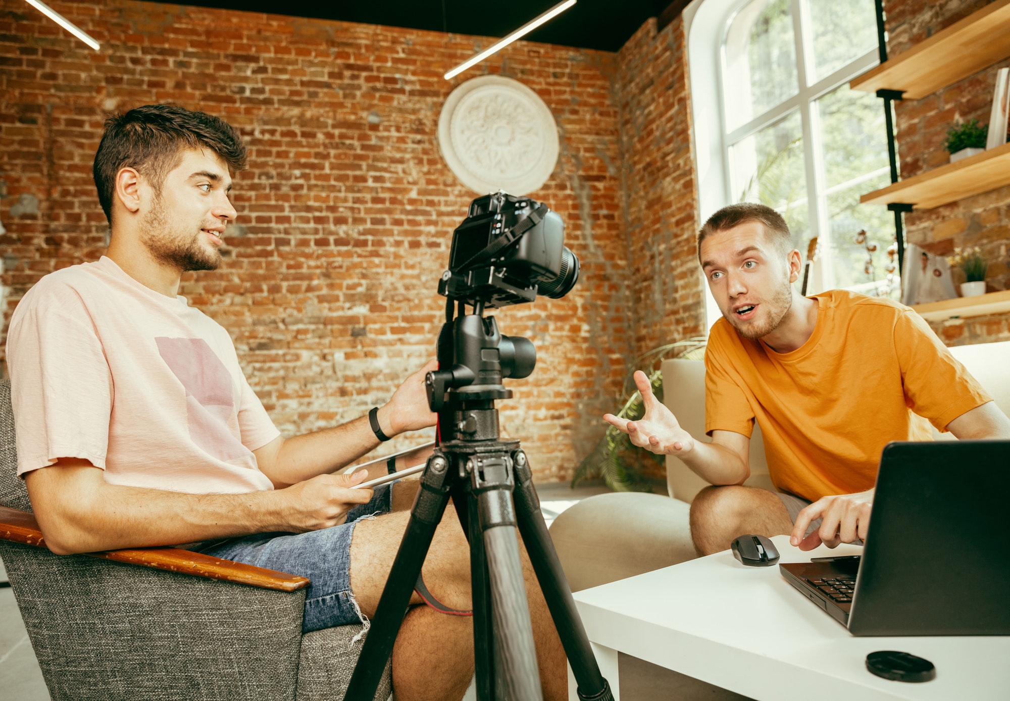 Two young male bloggers create user generated content