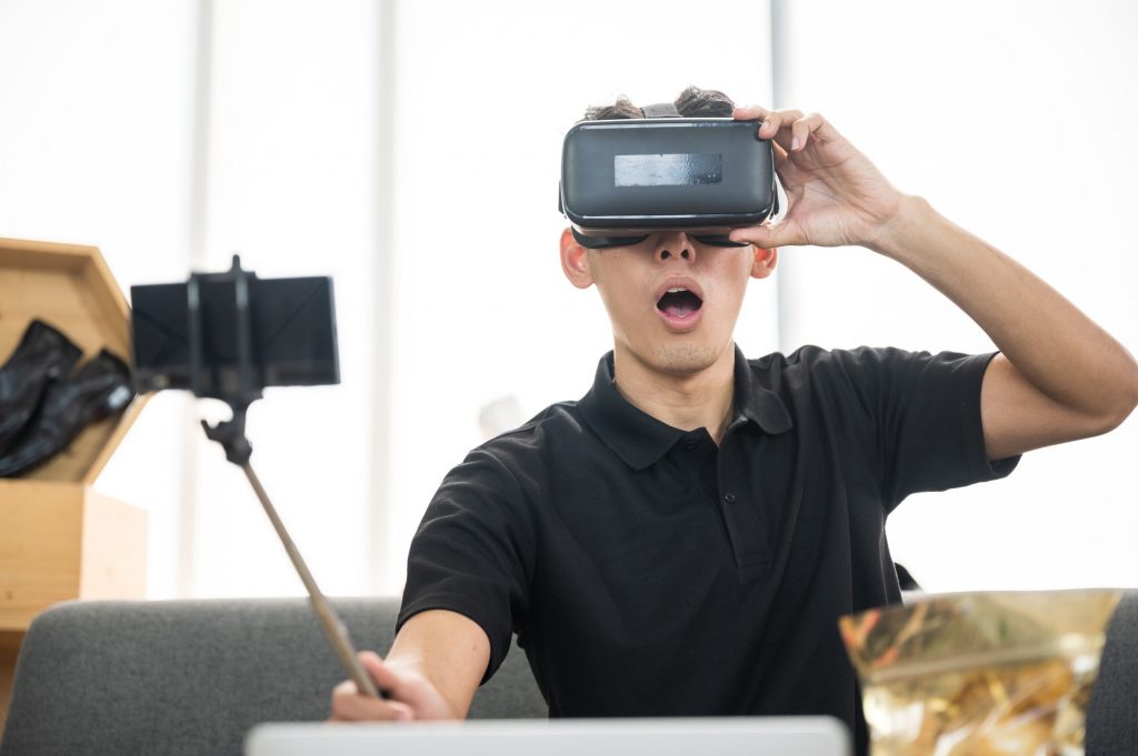 Teen playing a VR game. Learn to make products a must-have for teens.