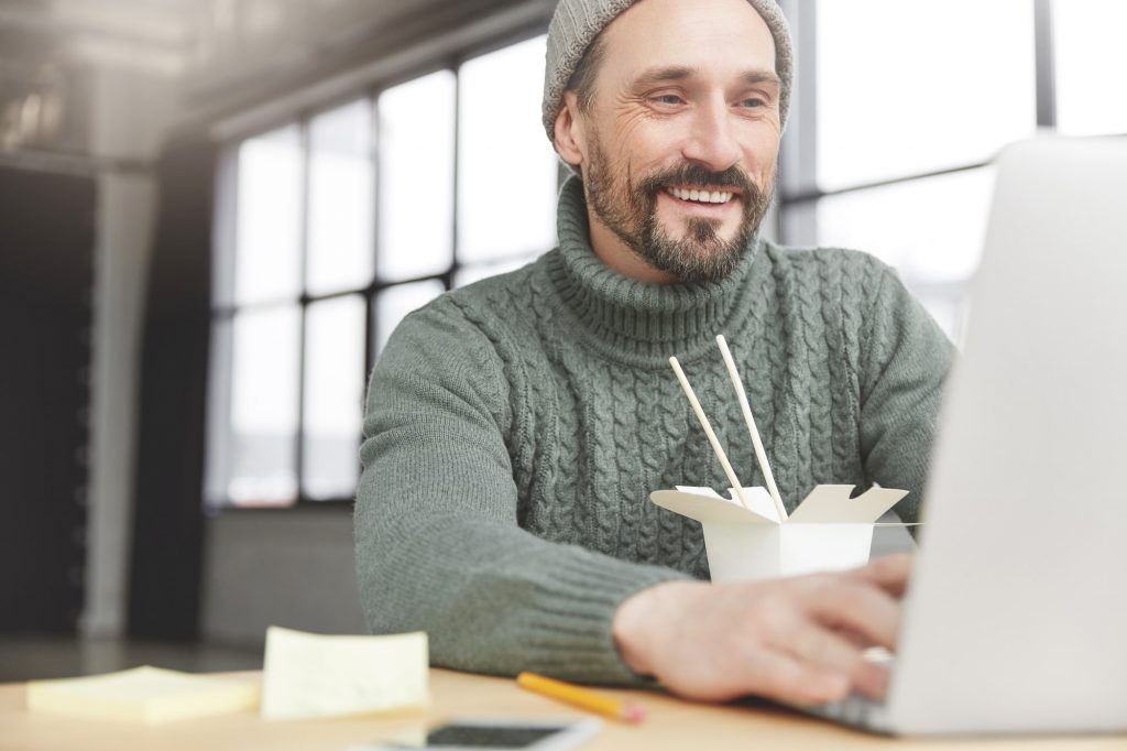 Man looking at an email introducing a company.