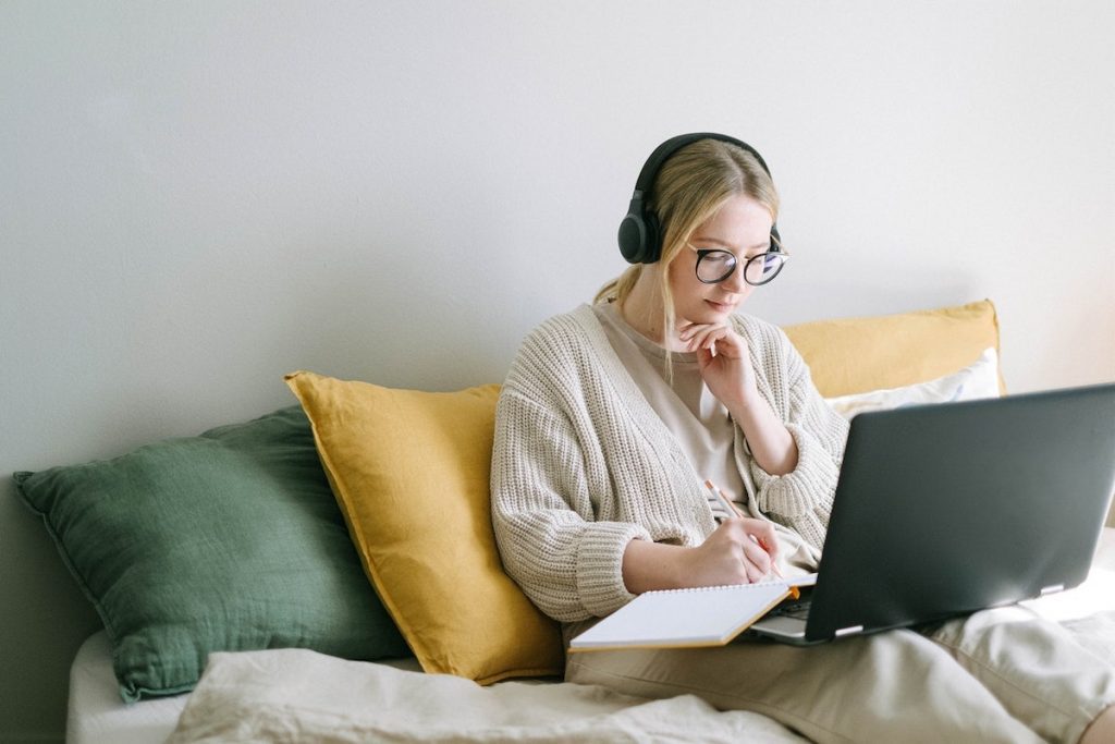 Woman using her laptop to make WordPress updates.