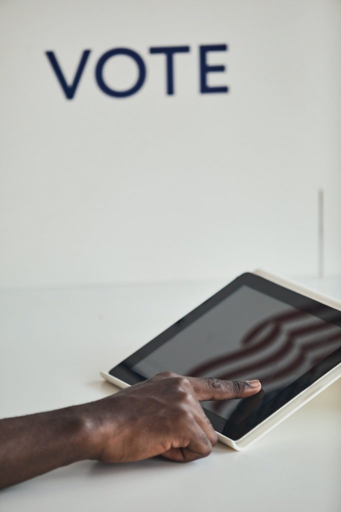 Man voting online with blockchain technology