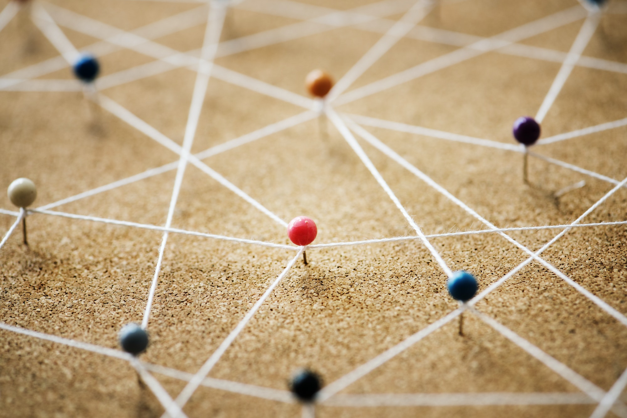 push pins and string representing an effective link building strategy