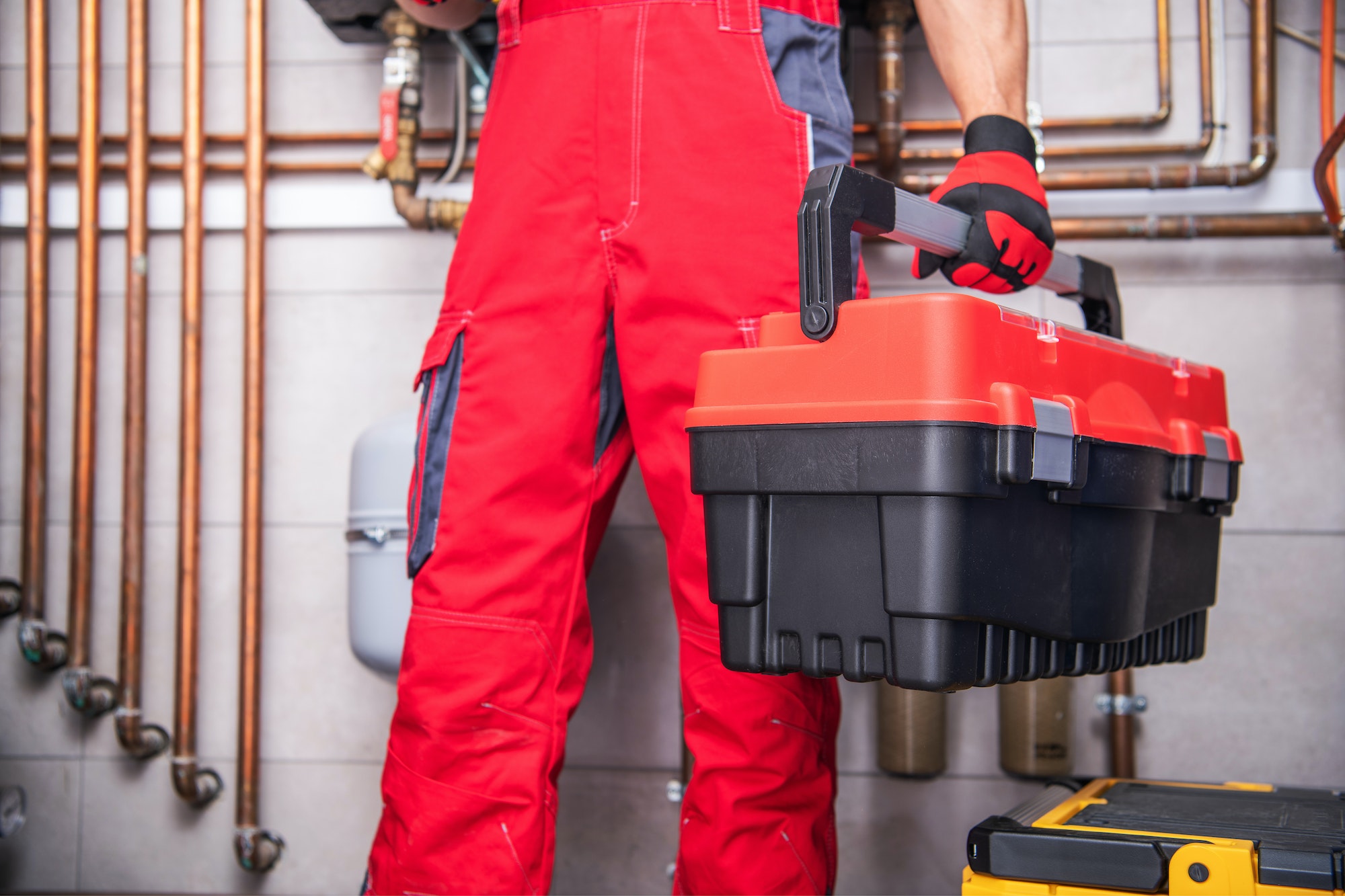 HVAC worker in a home. Home Services Marketing Agency.