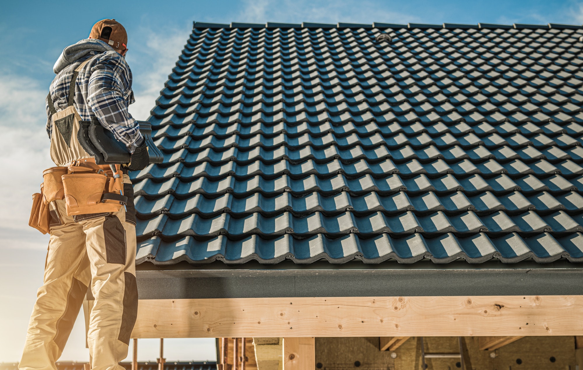 Tile Roofing Worker. St. Louis roofing marketing and St. Louis roofing SEO.