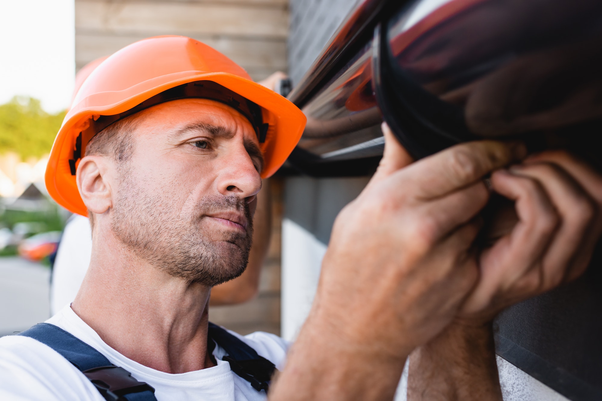 Man working on gutters. St. Louis Gutter Marketing And SEO Company.