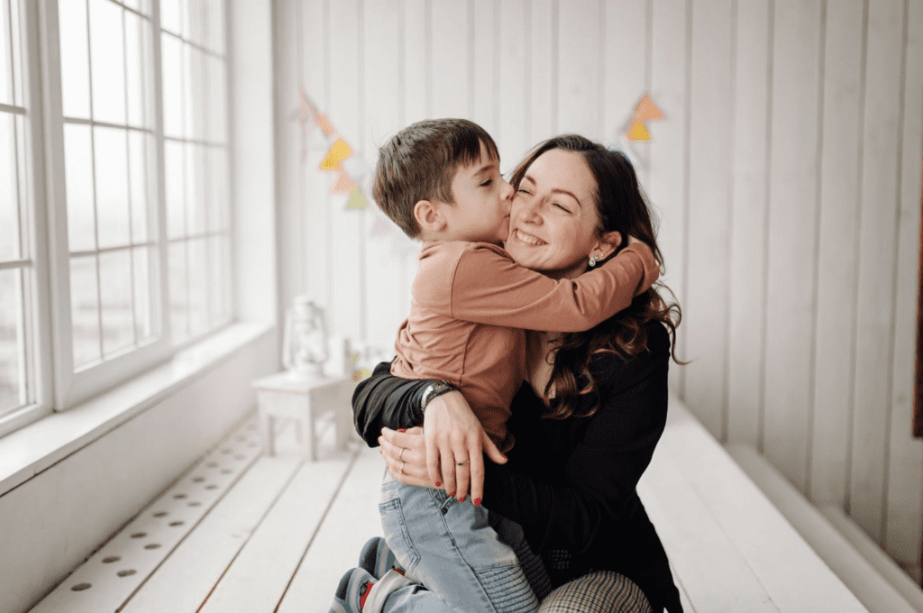 5 Must-Try Marketing Campaign Ideas. Kid kissing his mom.