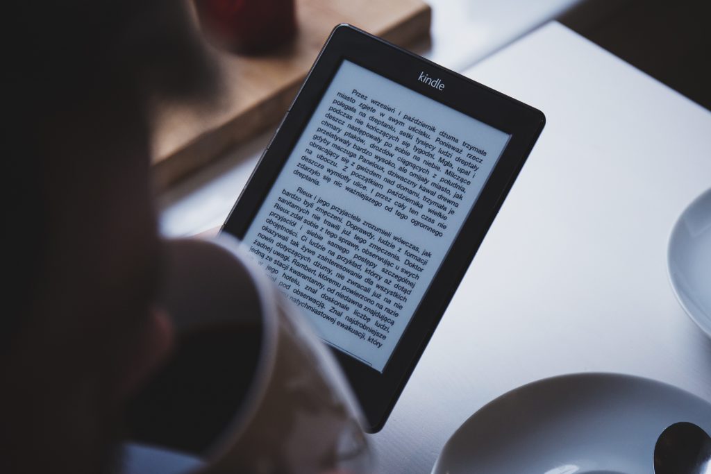 A person reading an ebook on a tablet.