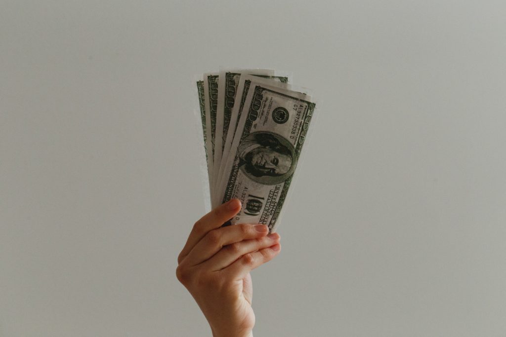 A hand holding cash