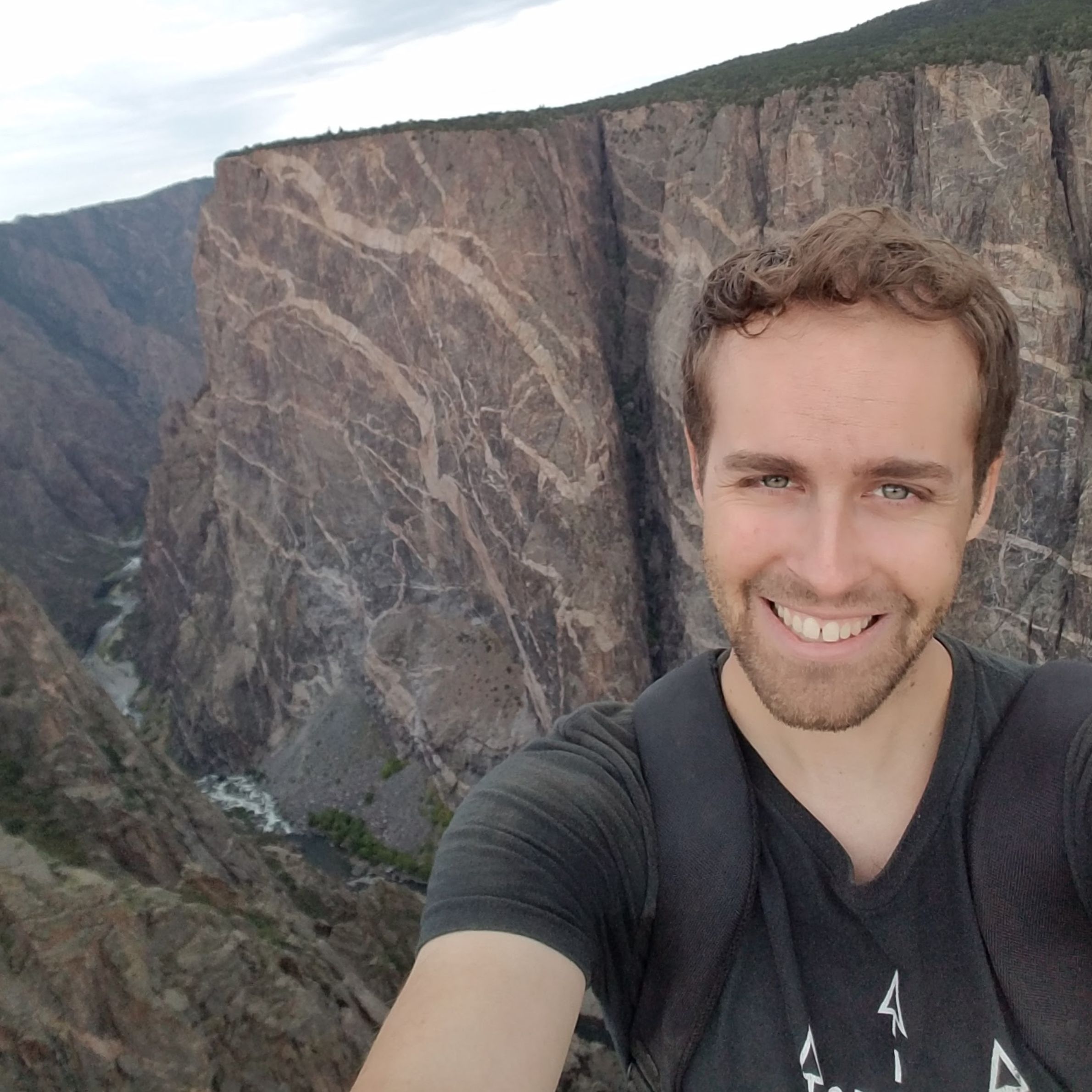 Keegan Dechant selfie in front of a picturesque canyon