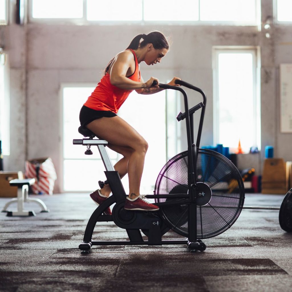 Fitness eCommerce SEO Case Study Strategy & Implementation. Woman riding stationary bike.