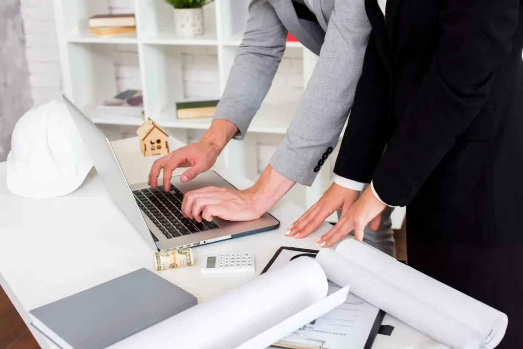 A real estate agent using a laptop