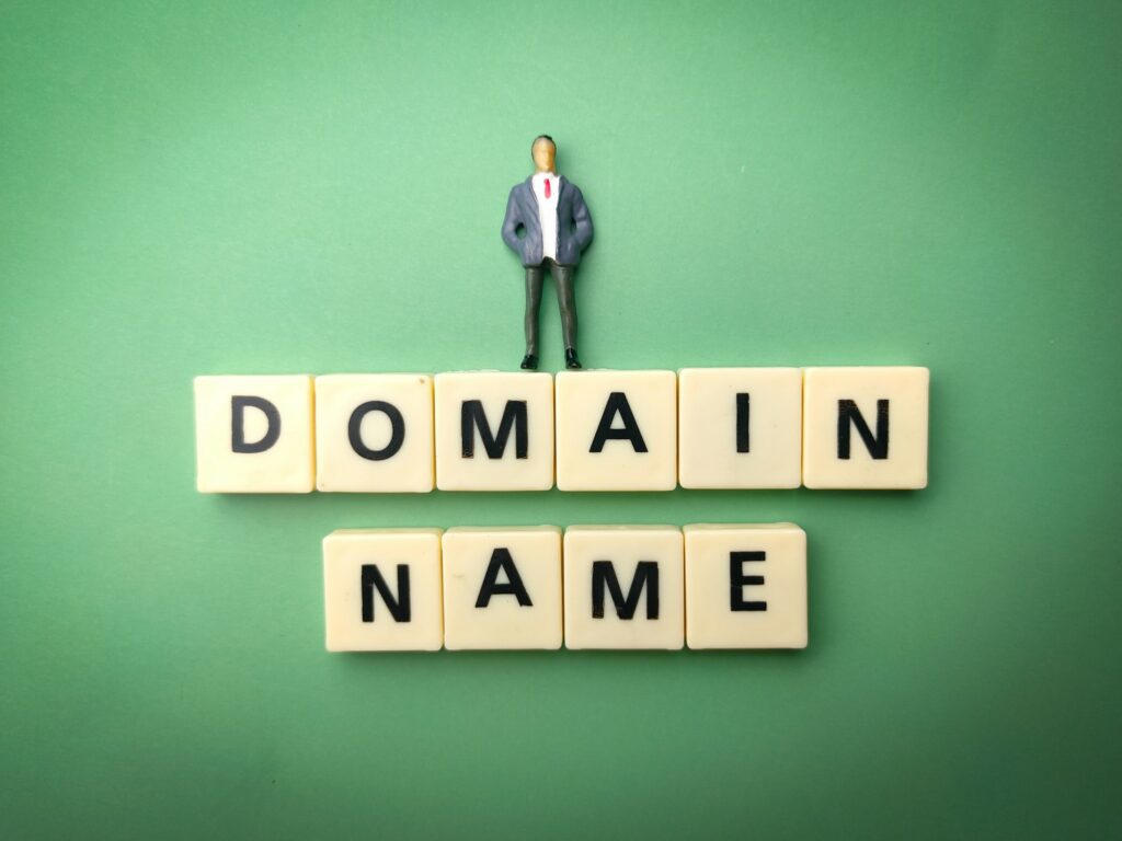 9 Ways To Fix The DNS_PROBE_FINISHED_NXDOMAIN Error. Man standing on Domain Name blocks.